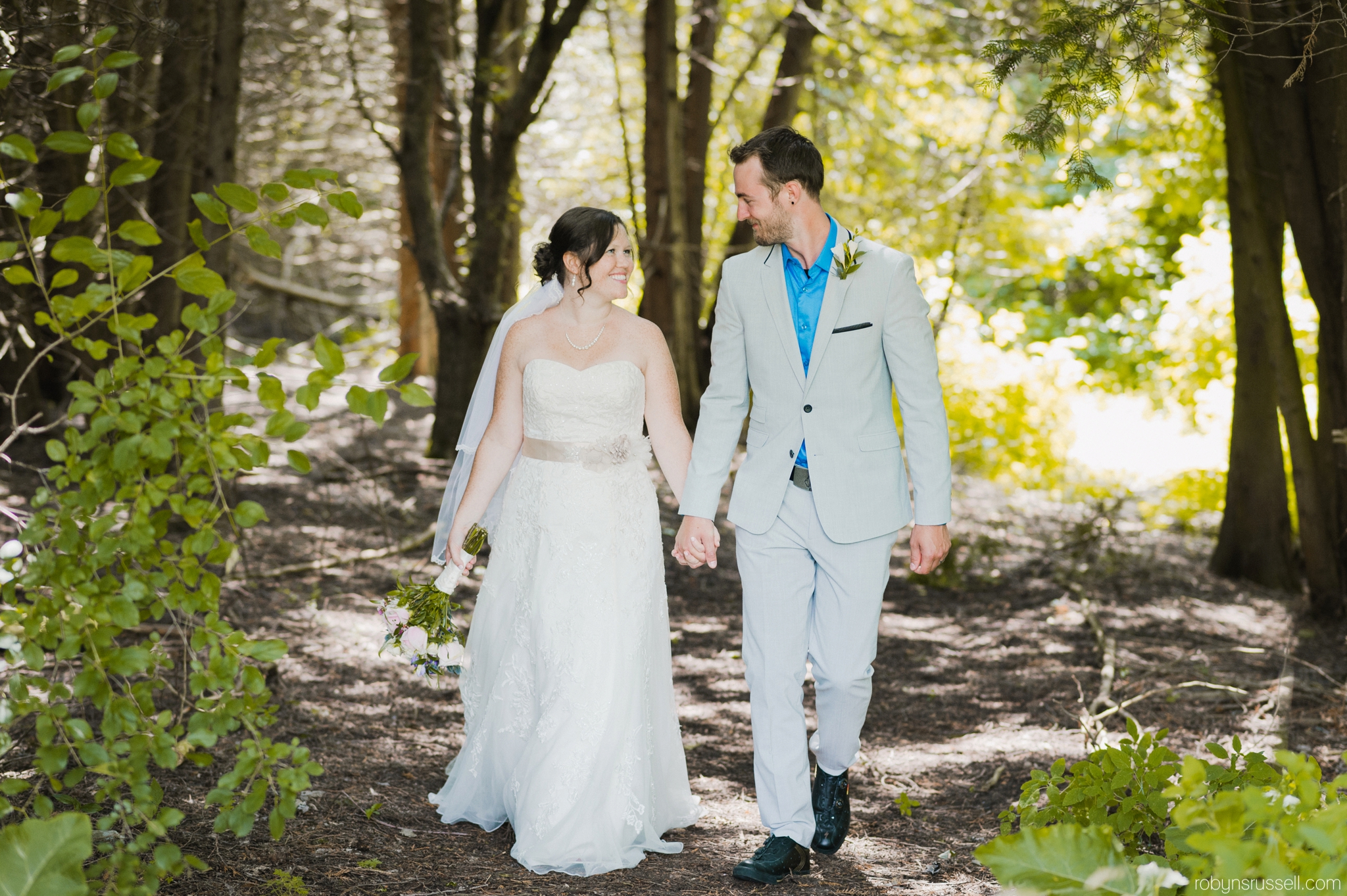 34-bride-and-groom-walking-from-forest.jpg