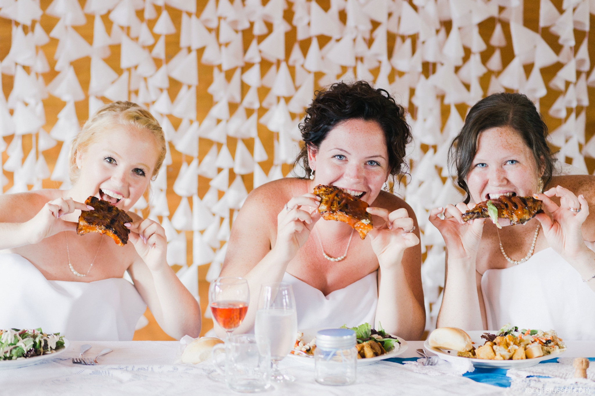 49-bride-and-bridesmaids-eating-ribs.jpg